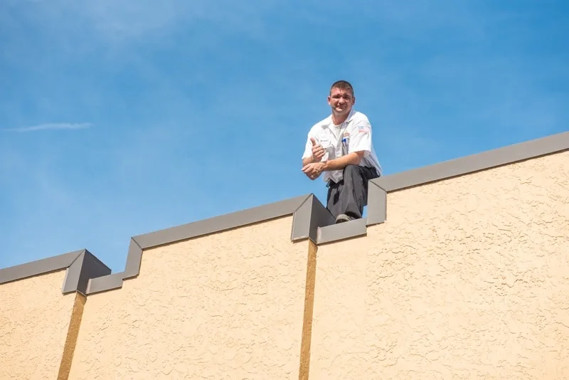 man on top of building